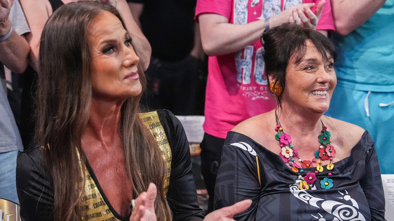 Alundra Blayze and Leilani Kai sit at ringside for "WWE Evolution."