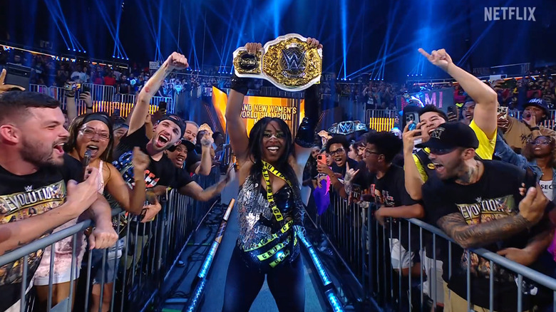 Naomi holding up the Women's World Championship belt
