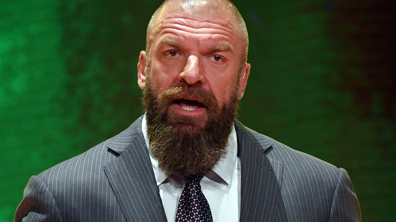 Triple H wearing a suit