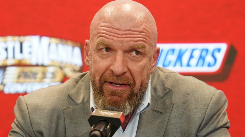 Triple H answer questions at a press conference
