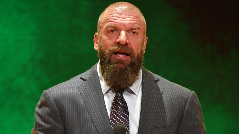 Triple H wearing a suit