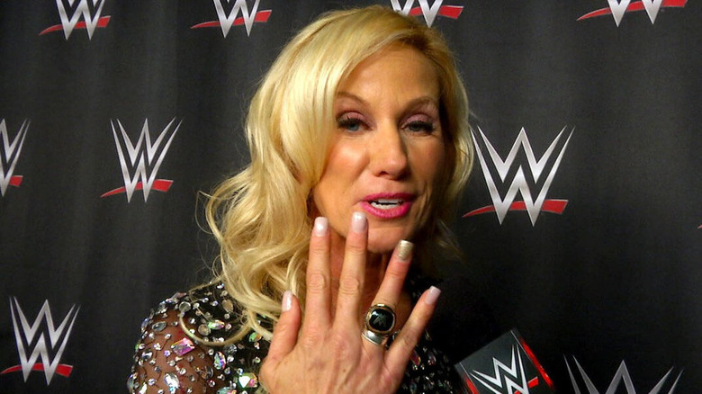 Alundra Blayze showing off her WWE Hall of Fame ring during a backstage interview