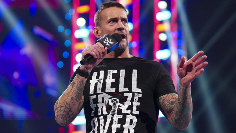 CM Punk holding a microphone