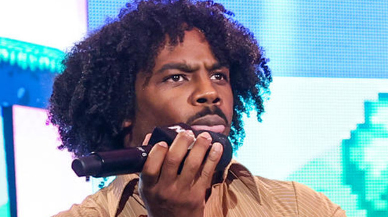 Xavier Woods serious face microphone