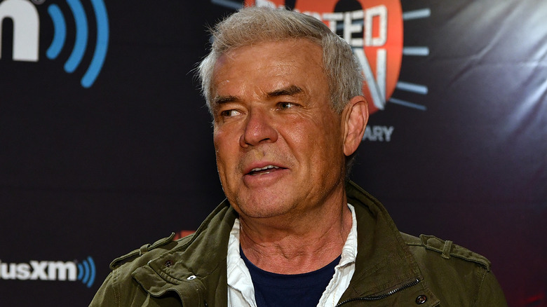 Eric Bischoff wearing a green jacket at a Busted Open event