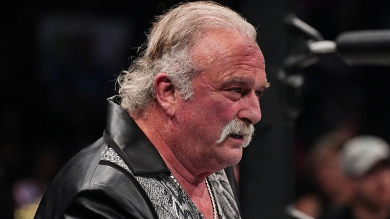 Jake Roberts watching Lance Archer beating someone up