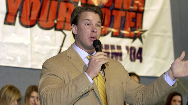 JBL holding a mic