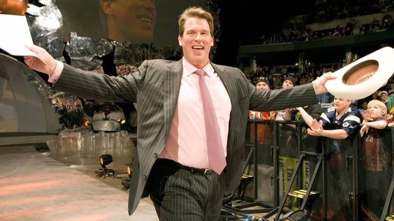 WWE Hall of Famer JBL comes down a WWE entrance ramp.