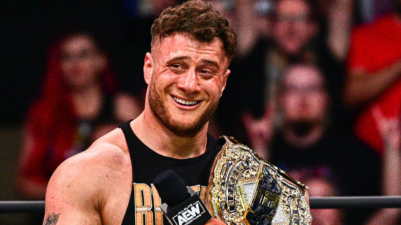 MJF grinning with AEW Title