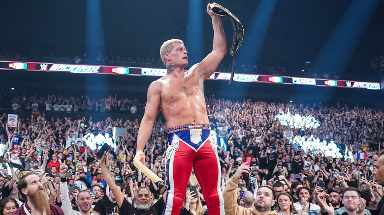 Cody Rhodes posing with the title at Backlash