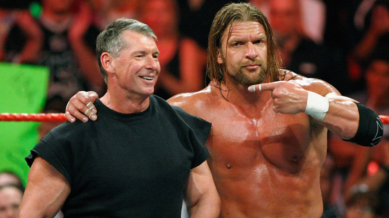 Paul Levesque pointing at Vince McMahon in an older photo