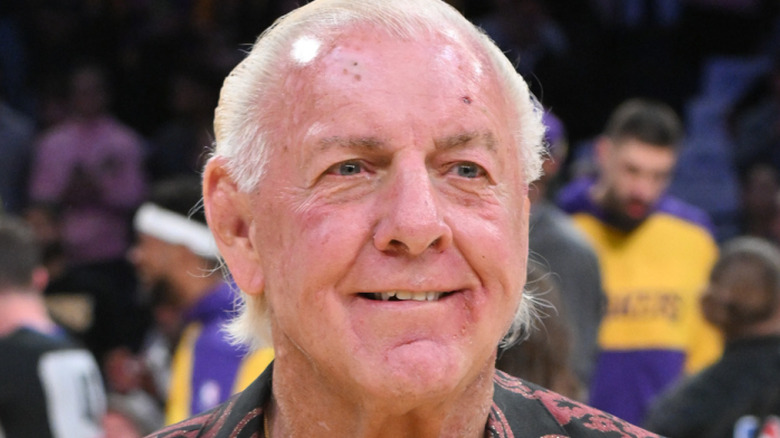 Ric flair standing on basketball court