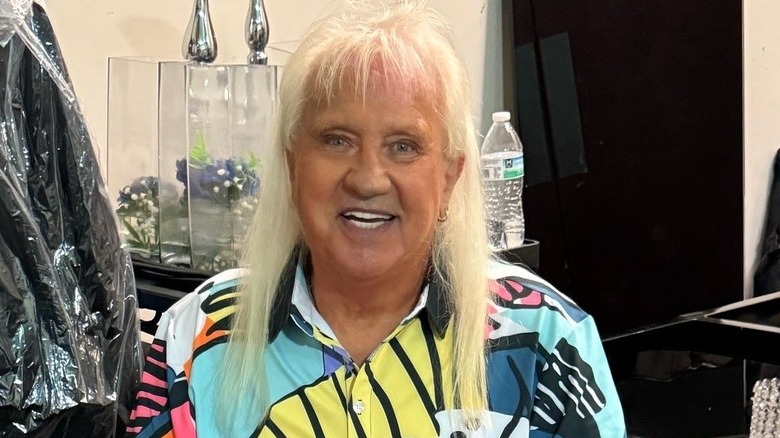 Ricky Morton wearing a colorful button-up shirt