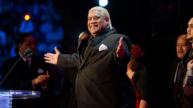 Rikishi Fatu being welcomed on stage during his WWE Hall of Fame induction.