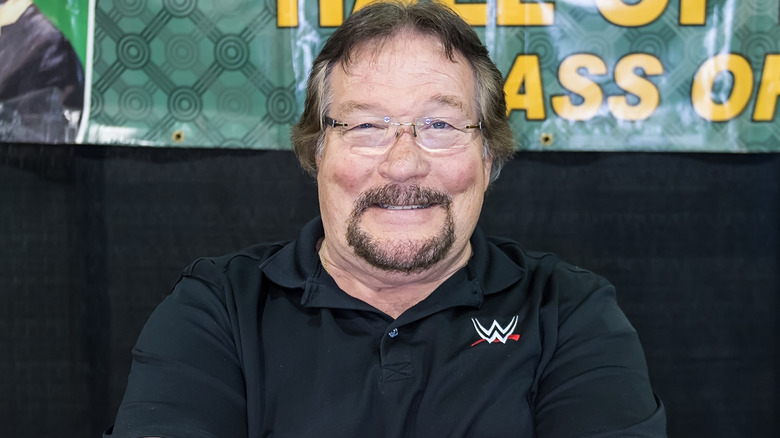 Ted DiBiase wearing glasses