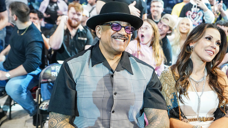 Charles Wright AKA The Godfather sitting next to Mickie James