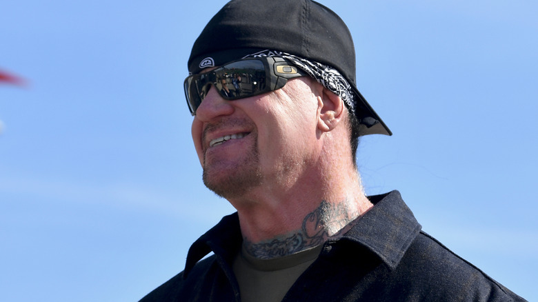 The Undertaker is wearing sunglasses