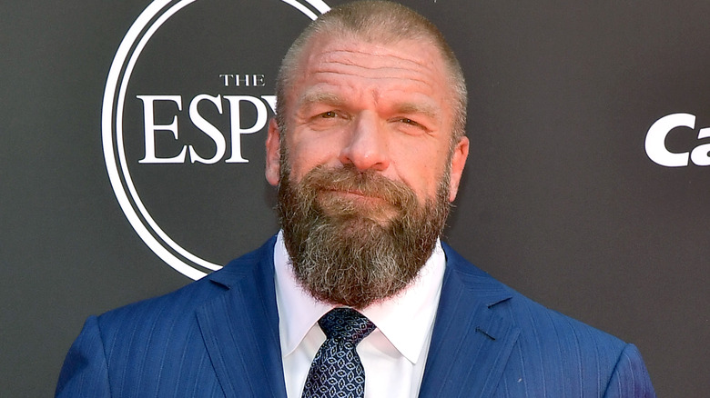 Triple H posing