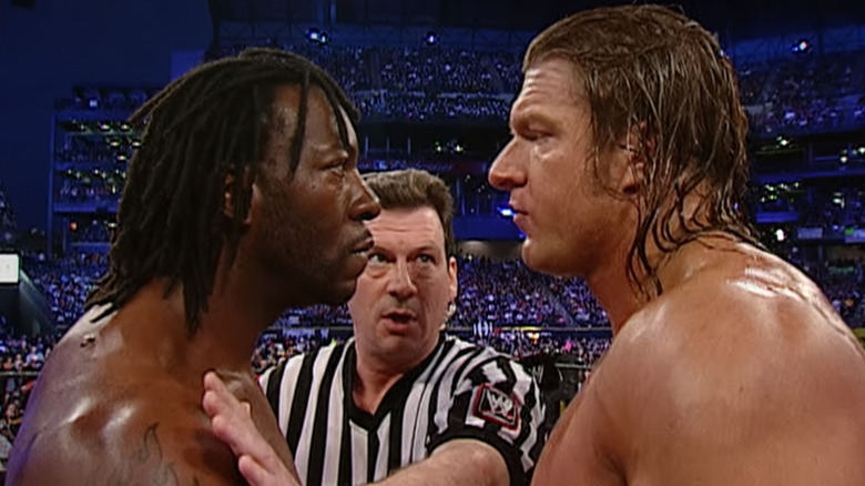 Booker T and Triple H facing off at WWE WrestleMania 19