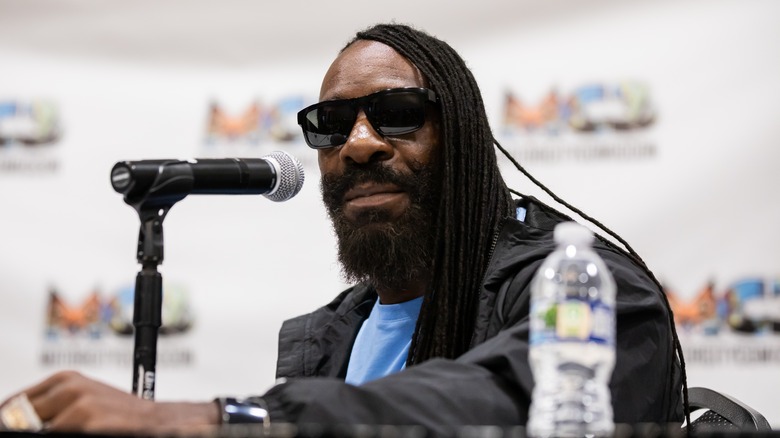 Booker T wearing shades that would block out the sun
