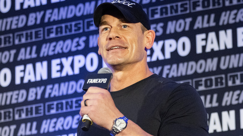 John Cena holding a microphone