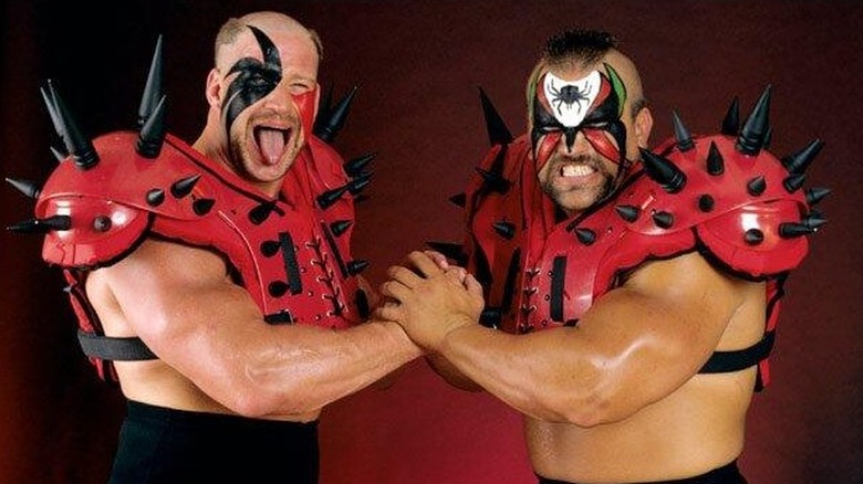 WWE's The Road Warriors (Hawk on the left and Animal on the right) pose as part of a backstage photoshoot