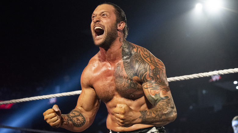Karrion Kross projects an aggressive pose before stepping into the ring