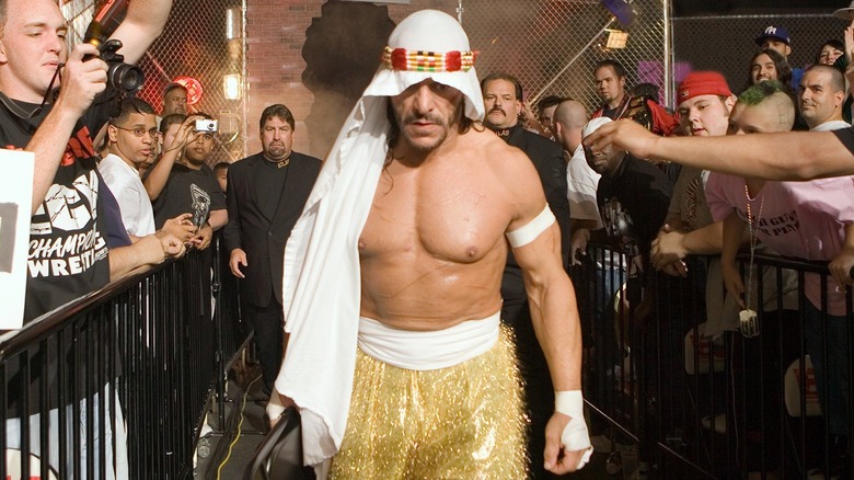 Sabu making his entrance surrounded by a crowd