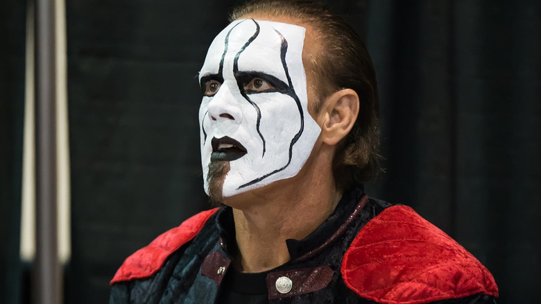 Sting wearing black and white face paint