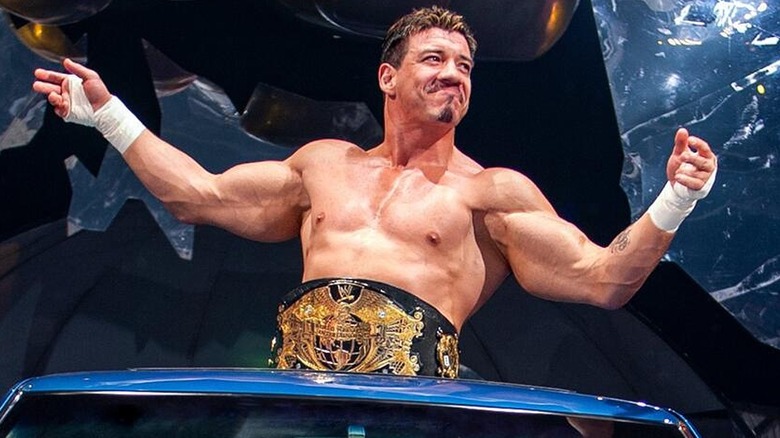 Eddie Guerrero making his way to the ring with the WWE Championship while driving his lowrider.