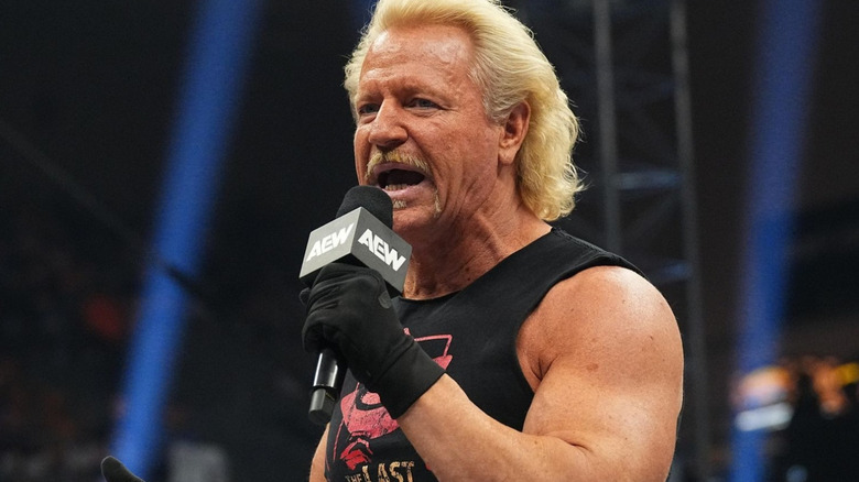 Jeff Jarrett holding a microphone