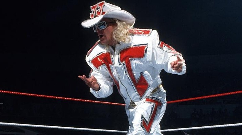 Jeff Jarrett in ring doing his signature strut after making his entrance in the arena.