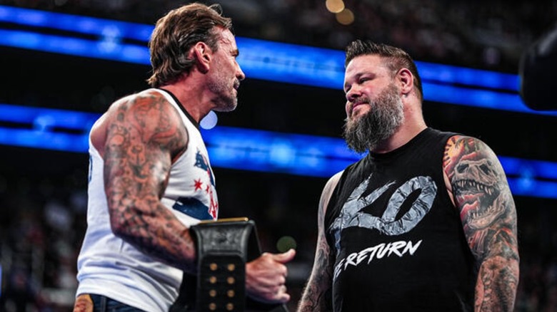 CM Punk and Kevin Owens in the ring
