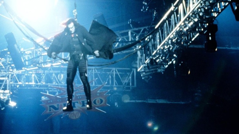 Sting rappels down from the ceiling during an appearance on WCW programming in an old, blurry photo posted to WWE's website.