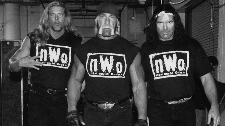 Kevin Nash, Hulk Hogan, and Scott Hall as the New World Order backstage for a photoshoot during their WWE run with the faction.