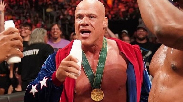 WWE Hall of Famer Kurt Angle enjoys a cold one (a tall glass of milk) with The Street Profits after their tag team match on "WWE Raw."