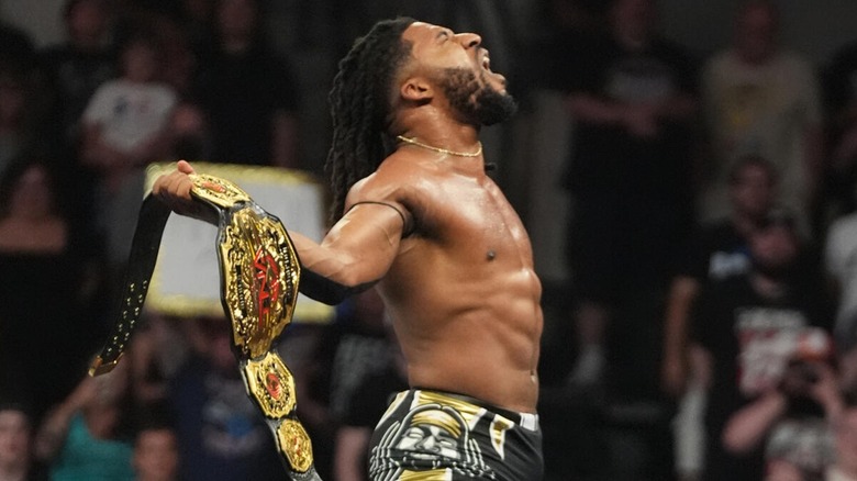 Trick Williams with the TNA World Championship after defeating Joe Hendry for the title at NXT Battleground.