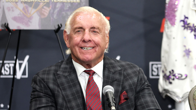 Hall of Famer Ric Flair smiles on during a press event