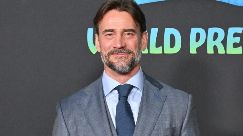 CM Punk is wearing a suit