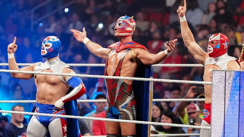 El Grande Americano, Rayo, and Bravo, pose in the ring before a match on 