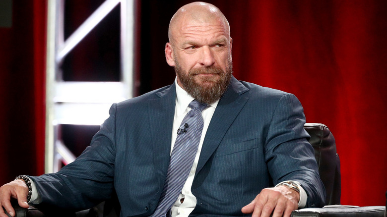 WWE CCO Triple H awaits a question during a press conference event