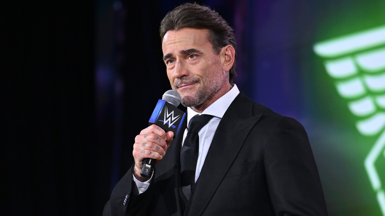 WWE Superstar CM Punk speaks in front of fans at the 2026 Fanatics Fest