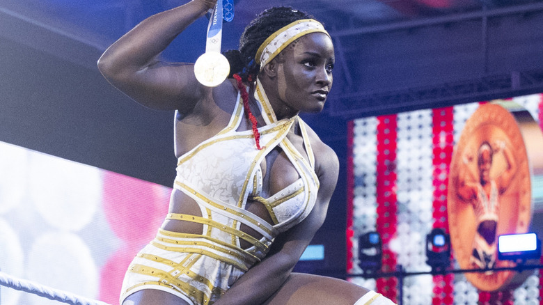 Tyra Mae Steele holding up a gold medal