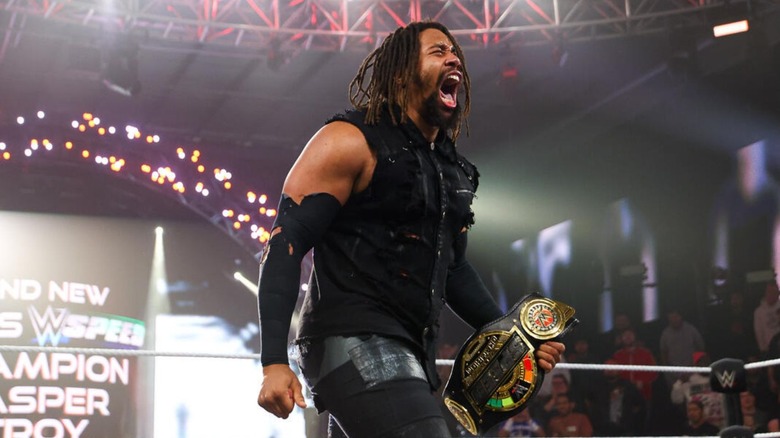 Jasper Troy celebrates in the ring after winning the WWE Speed Championship on 