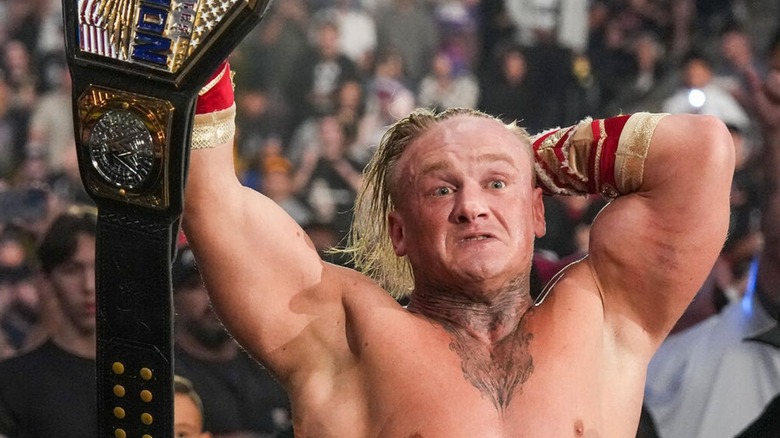 Ilja Dragunov holds up the United States Championship after a successful defense on 