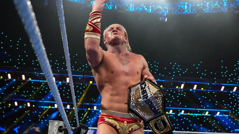 Ilja Dragunov poses in the ring, United States Championship in hand, after an open challenge victory on 