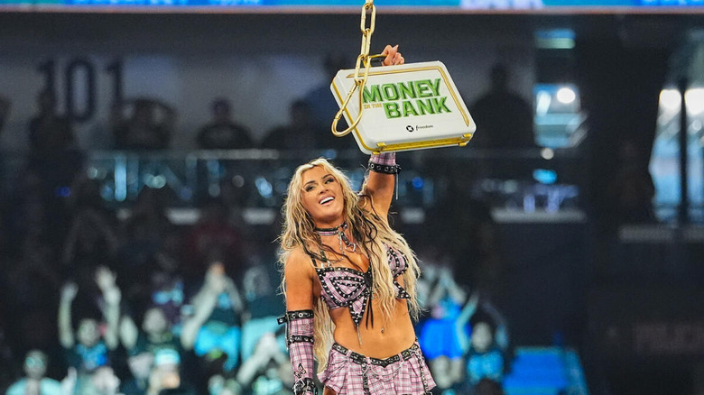 Tiffany Stratton celebrates with the MITB briefcase