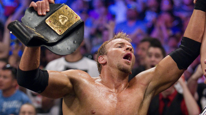 Cage holding up the World Heavyweight Championship