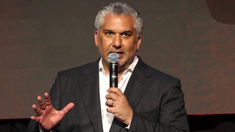 Nick Khan speaking into a microphone