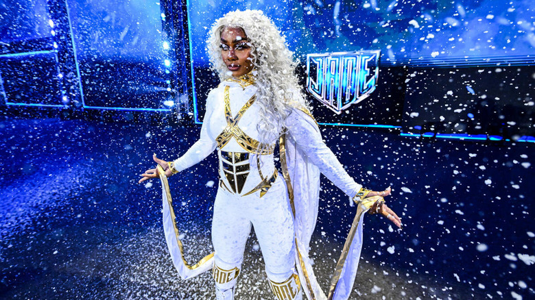 Jade Cargill poses as her entrance sees her covered in a flurry of white fake snow.